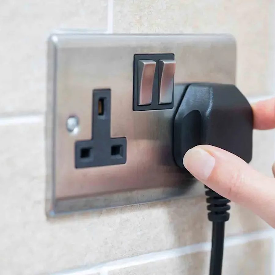 Plugging an appliance into a wall socket